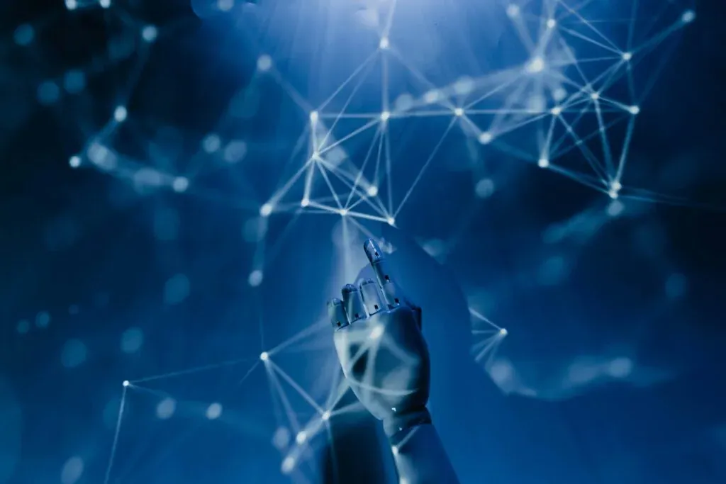 A robotic hand reaching into a network of glowing connections.